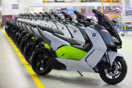 BMW C Evolution electric scooters manufactured by BMW Motorrad, a unit of Bayerische Motoren Werke AG, stand on display during an event to mark the start of production at the plant in Berlin, Germany, on Friday, April 4, 2014. German factory orders rose in February, adding to signs that growth in Europe's largest economy is gathering pace. Photographer: Krisztian Bocsi/Bloomberg via Getty Images